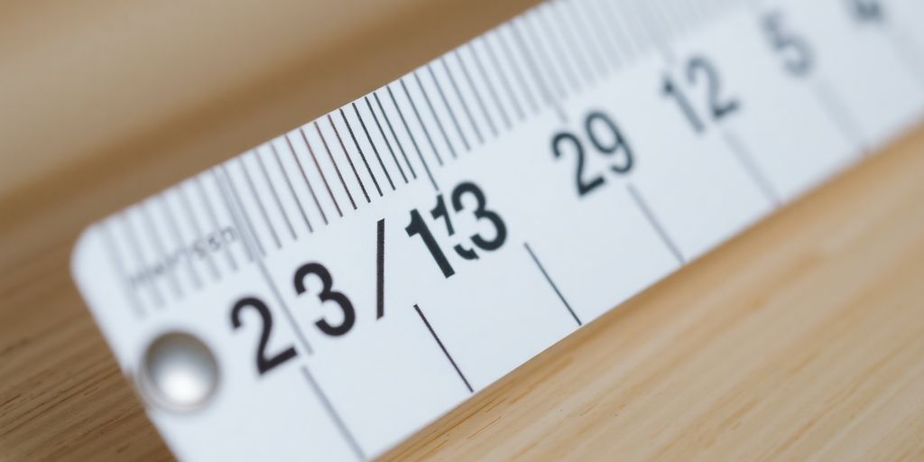 Measuring tape displaying 23/32 inches measurement.
