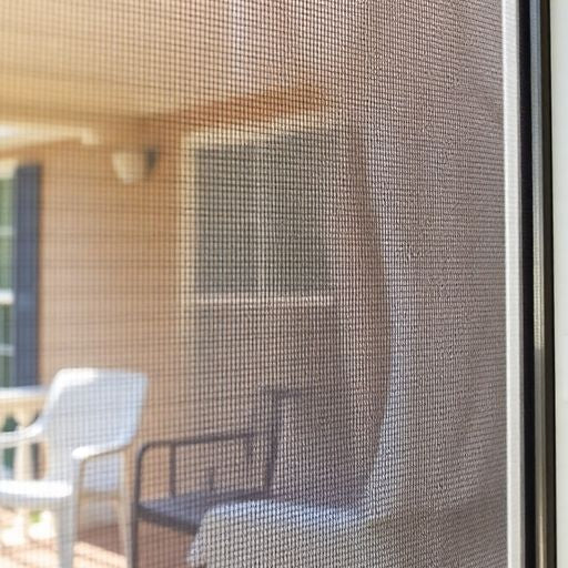 Close-up of a newly installed screen door.