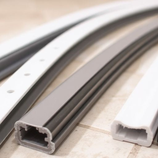 Variety of shower door seals on tile surface.