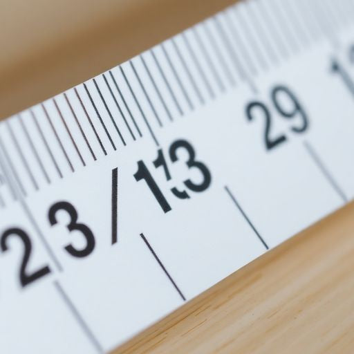 Measuring tape displaying 23/32 inches measurement.