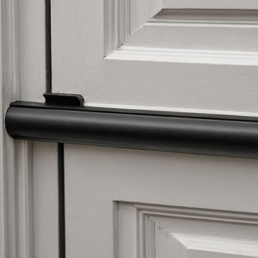 Close-up of bulb seal weatherstripping on door edge.
