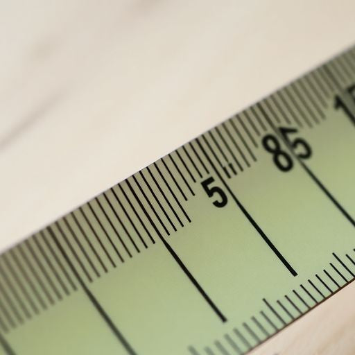 Close-up of a tape measure showing 15/32 inches.