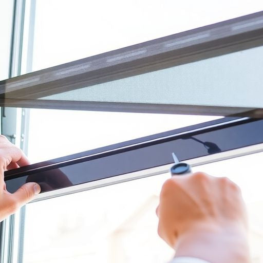 Person removing Pella window sash with tools.